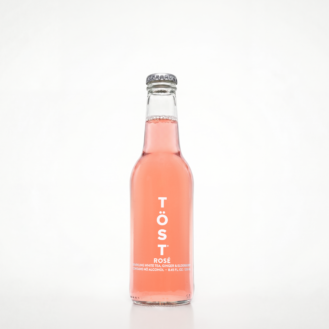 Bottle of Töst Rosé on a white background