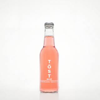 Bottle of Töst Rosé on a white background
