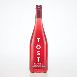Red bottle of Töst Sangria on a white background