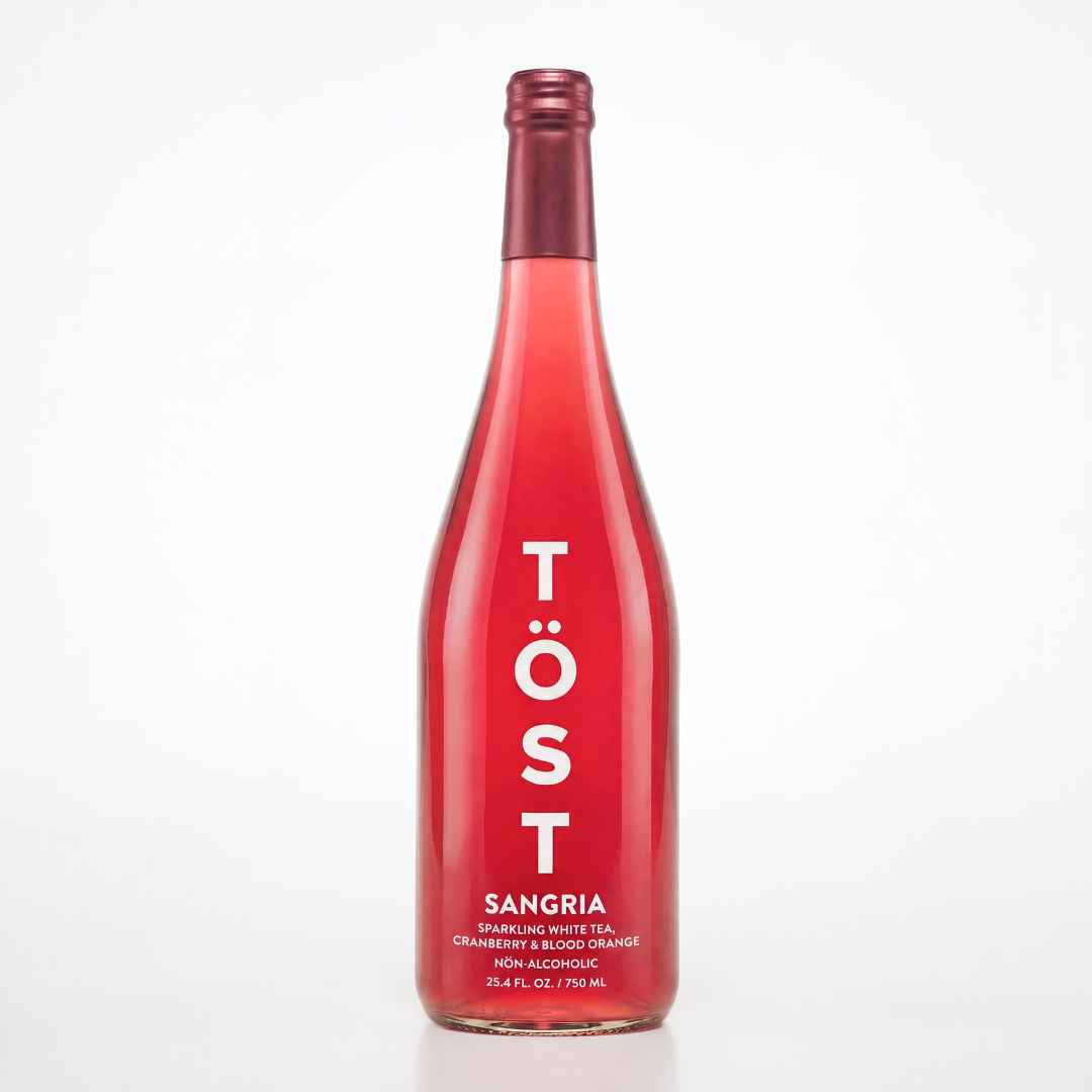 Red bottle of Töst Sangria on a white background
