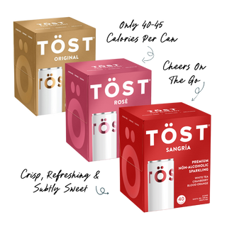 Three boxes of Töst drinks in different flavors on a white background
